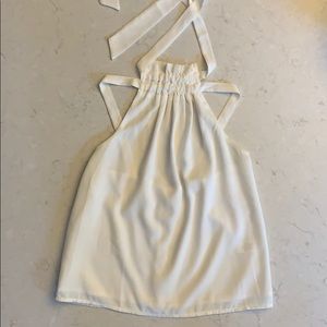 This is a white tank with a cool strappy back!